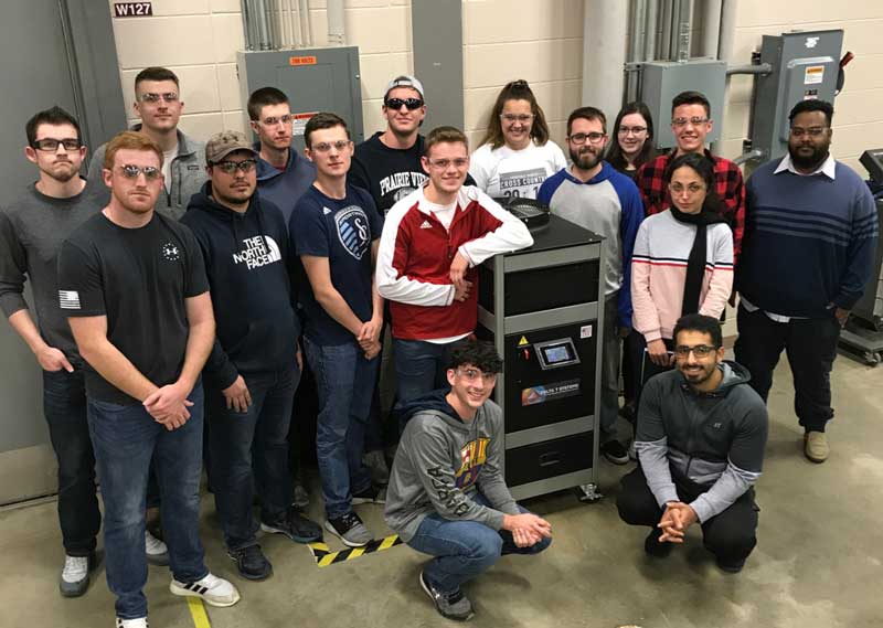 Students at Pittsburg State University by 2 ton variable speed air cooler chiller donated by Delta T Systems
